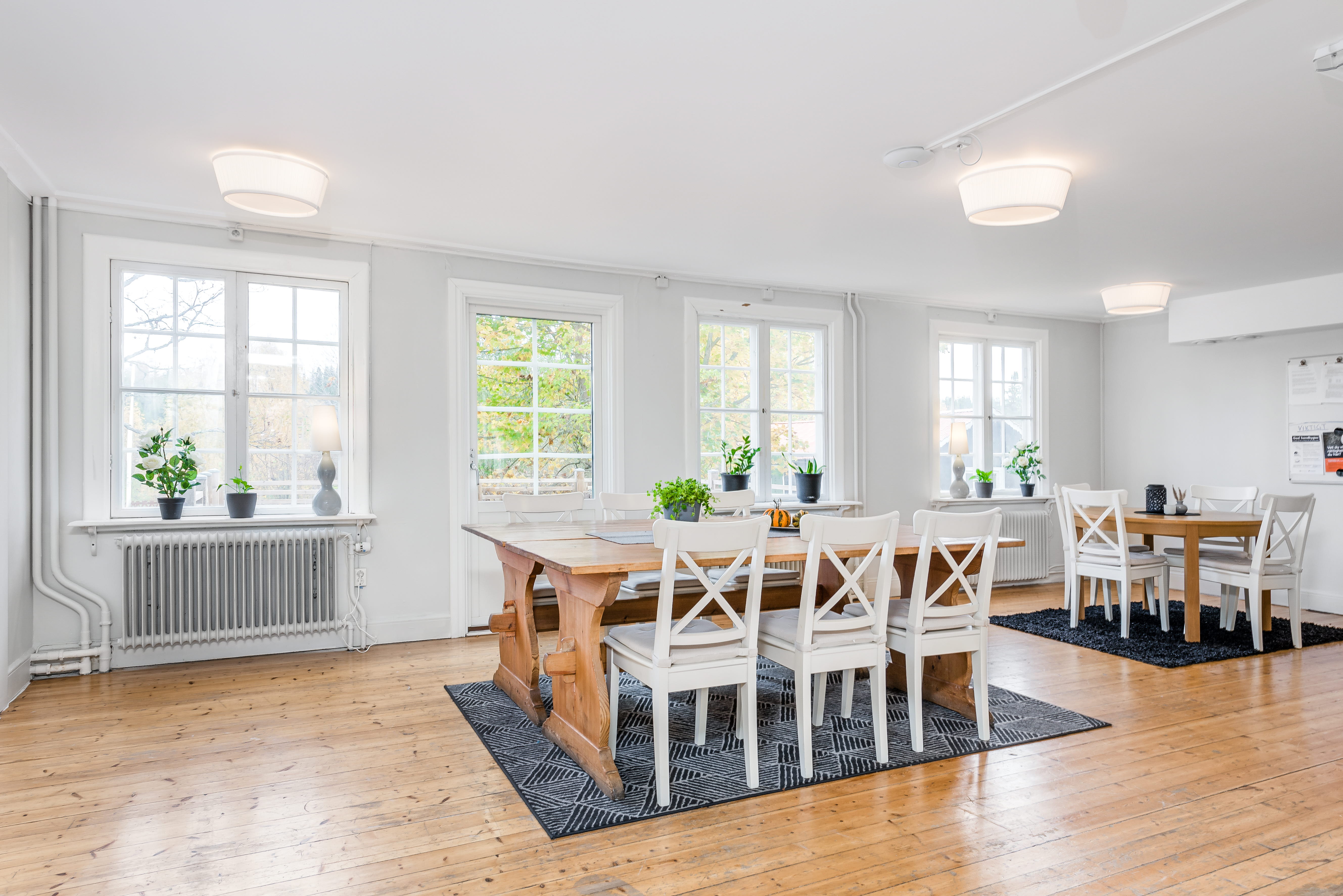A living room filled with furniture on top of a hard wood floor