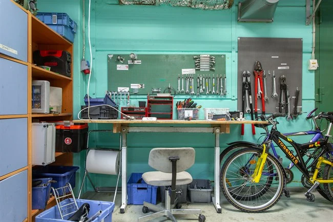 A blue bicycle in a room