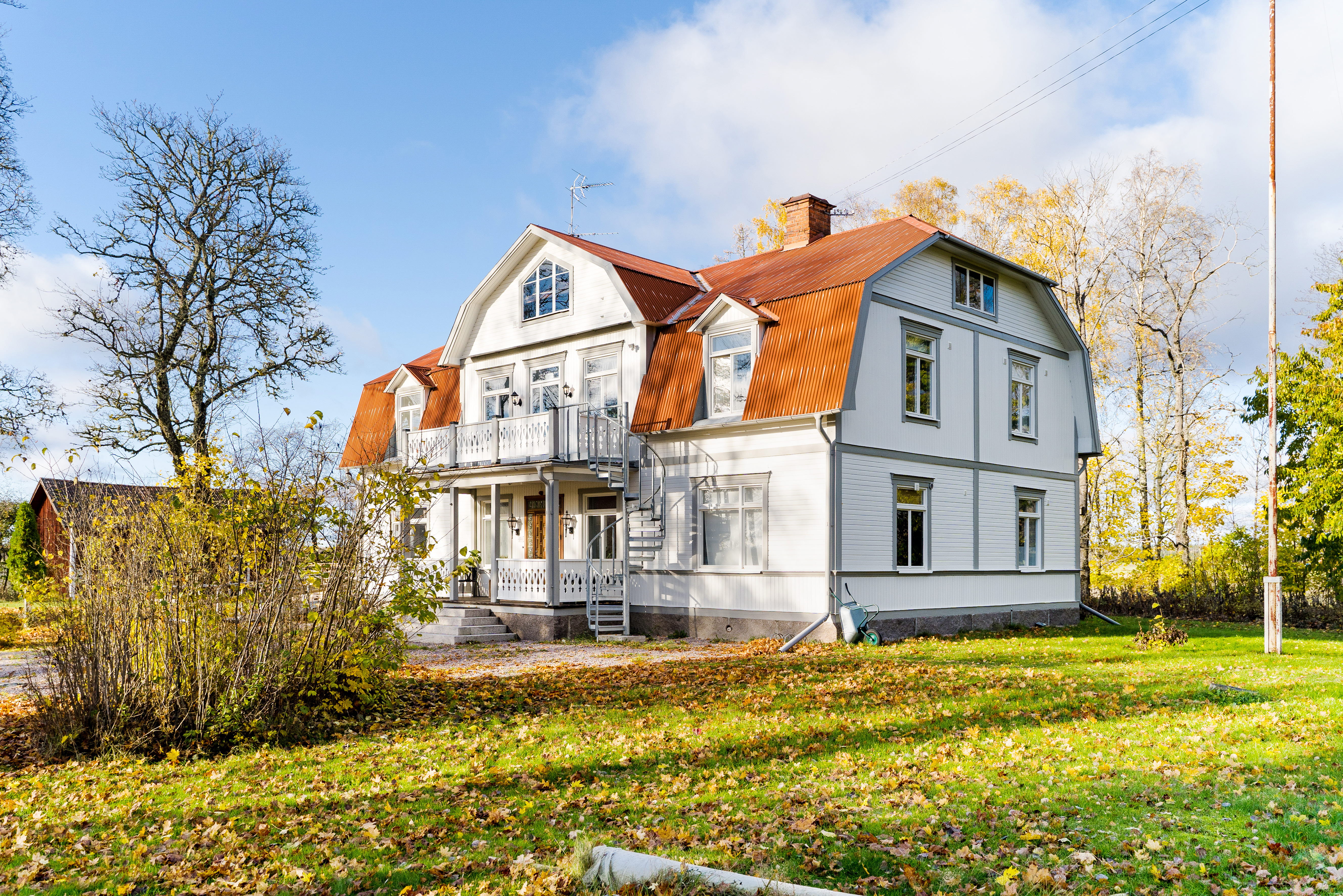 A tree in front of a house