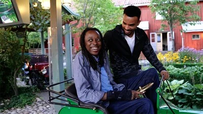 Two persons going on a rollercoster