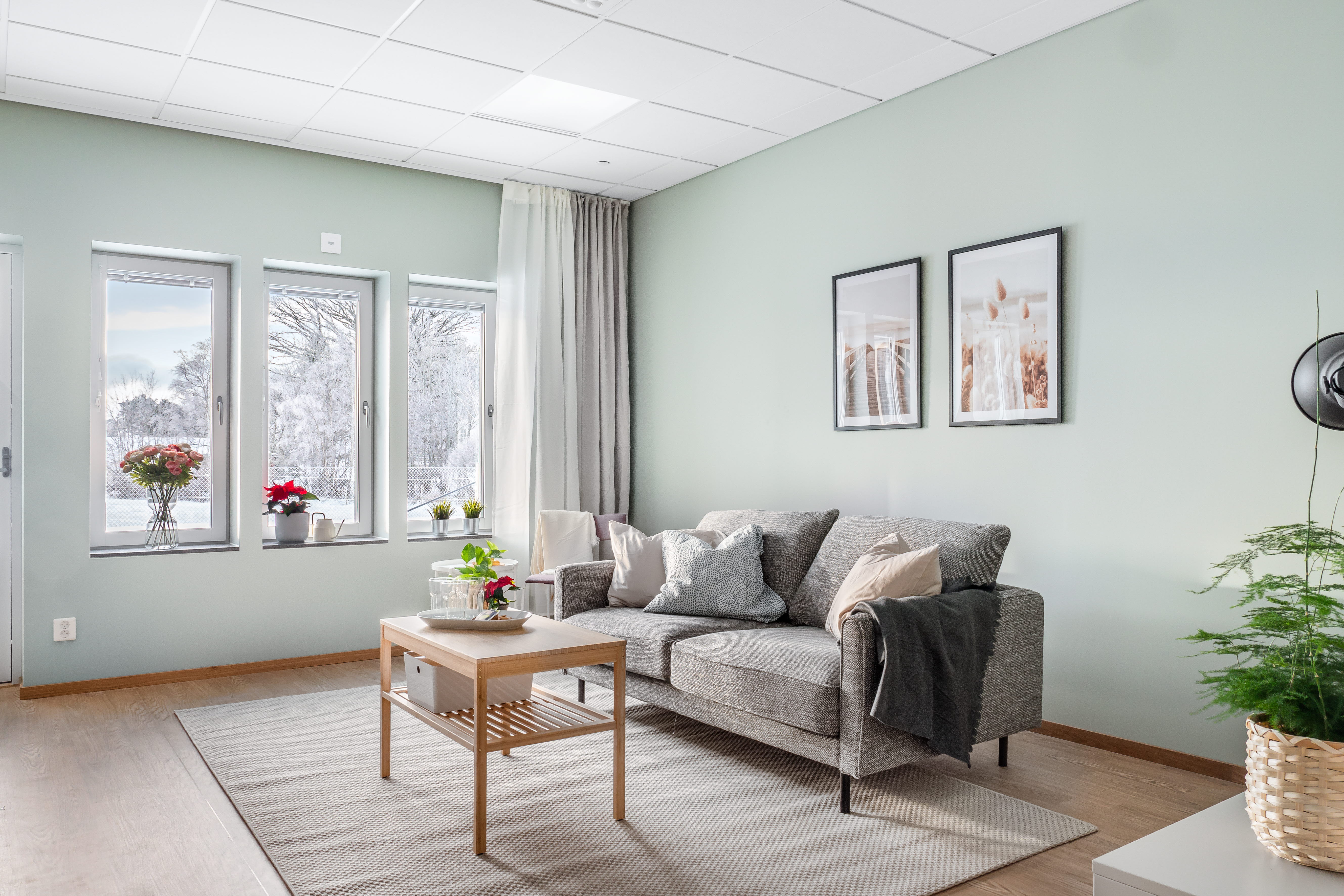 A living room filled with furniture and a large window