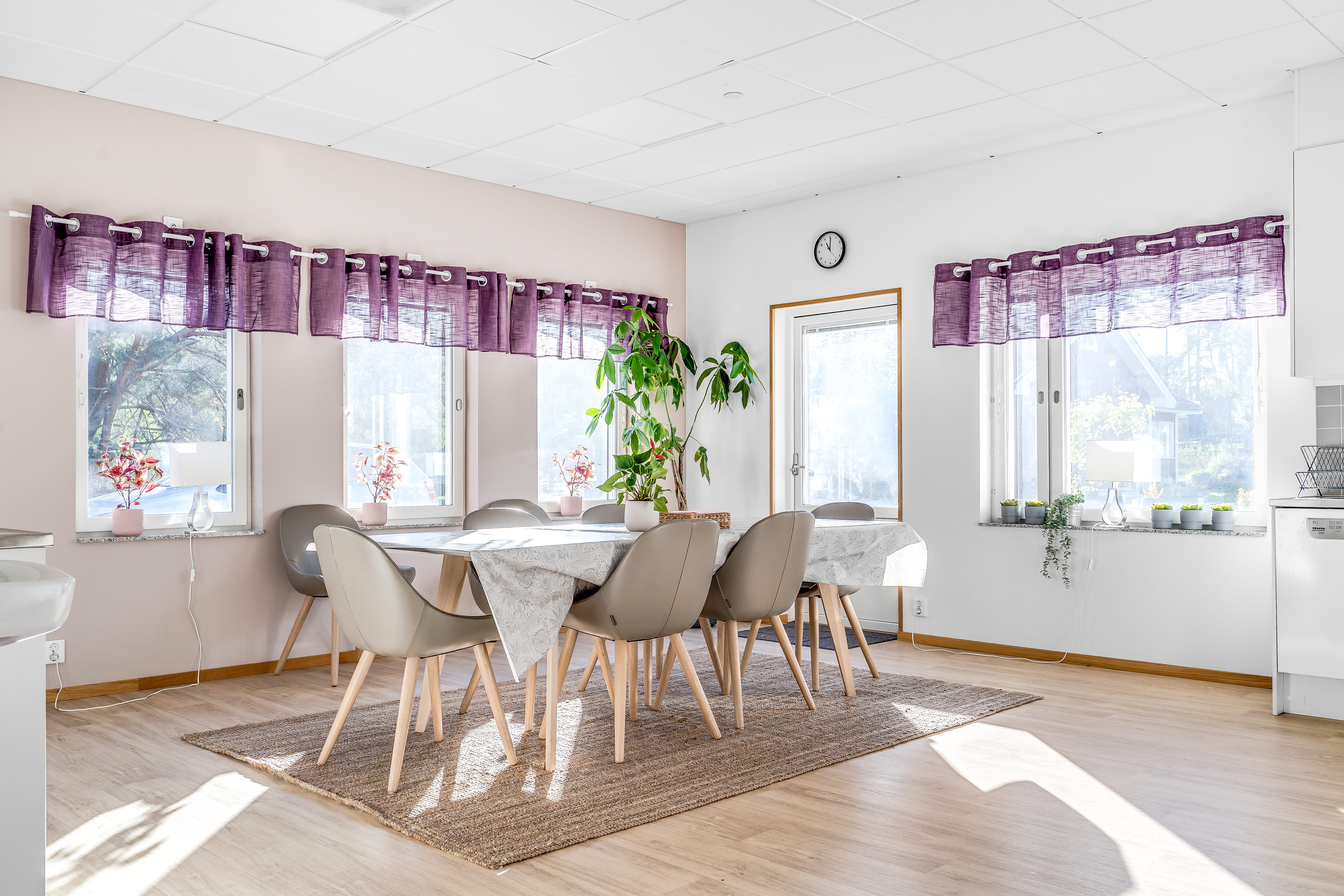 A living room filled with furniture and a large window