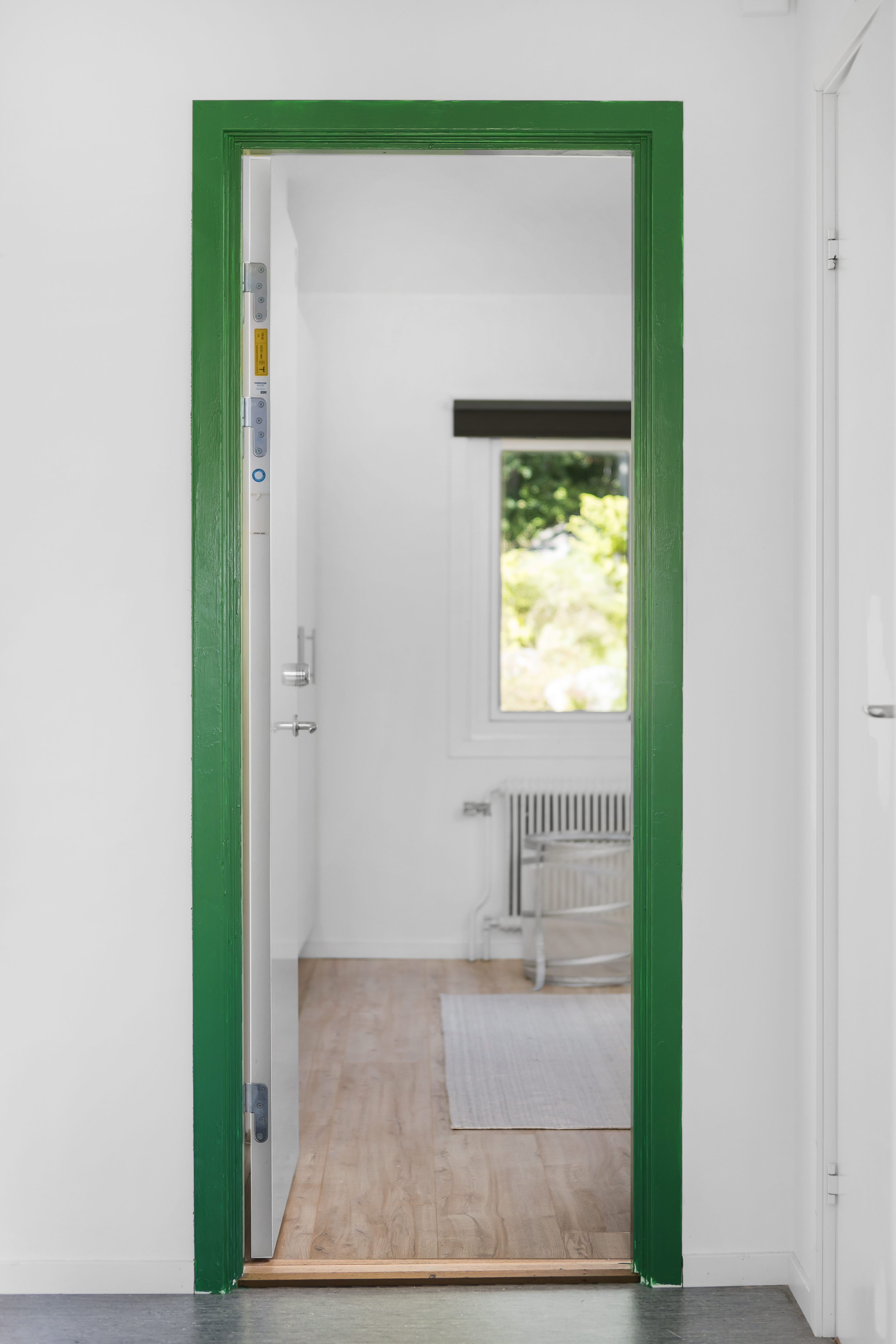 A room with a green door