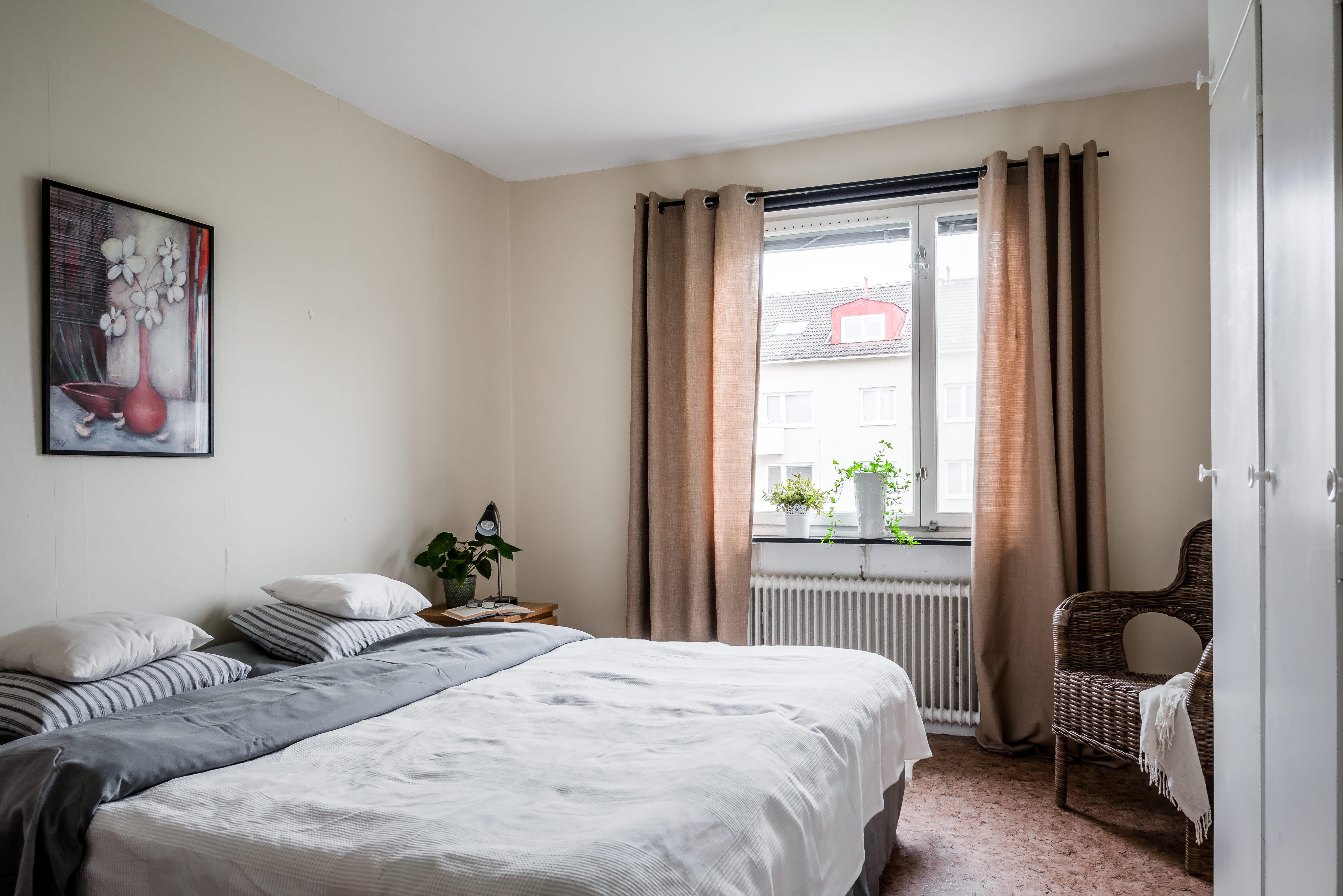 A bedroom with a large bed in a hotel room