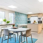 A kitchen with an island in the middle of a room
