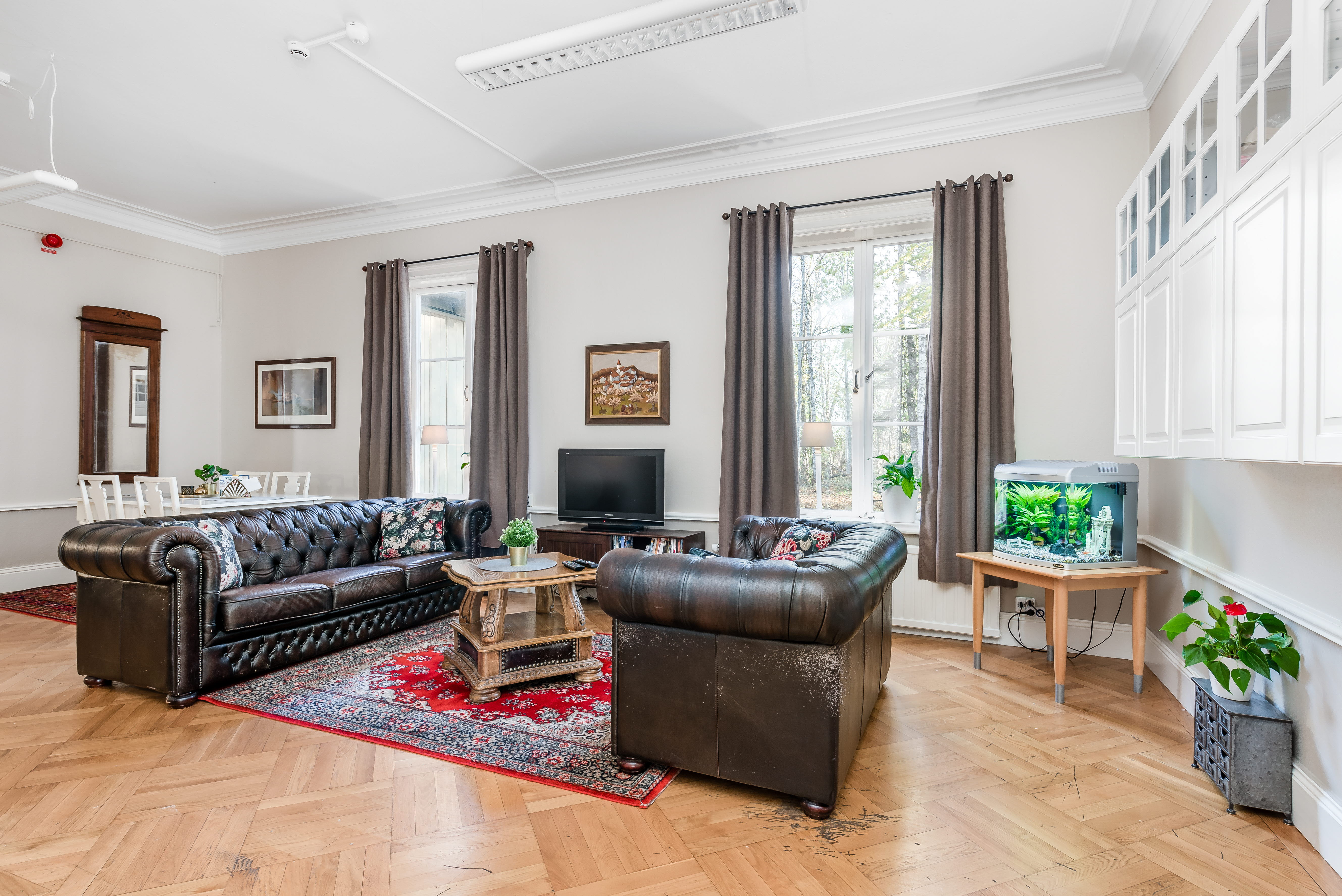 A living room filled with furniture and a fireplace