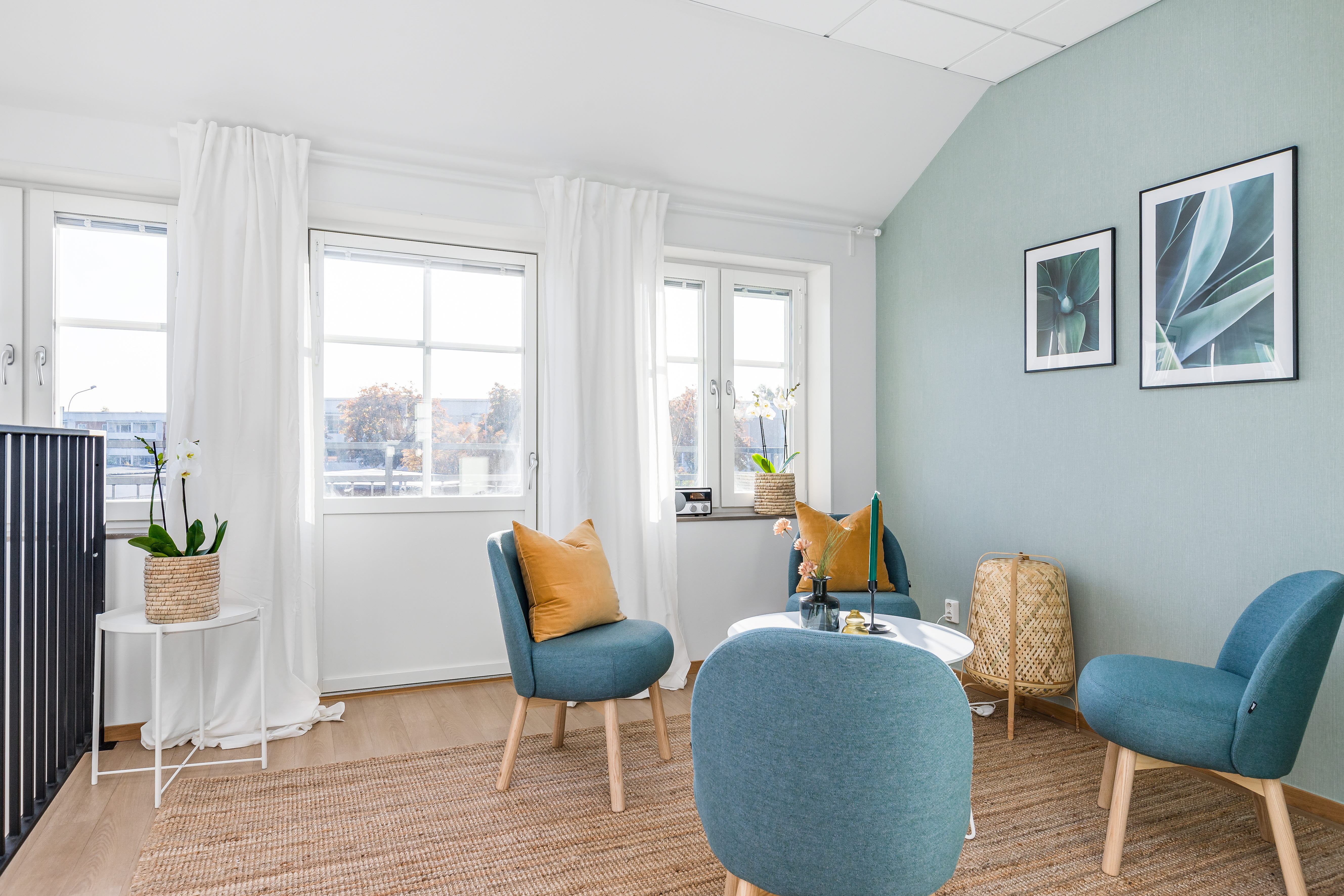 A living room filled with furniture and a large window