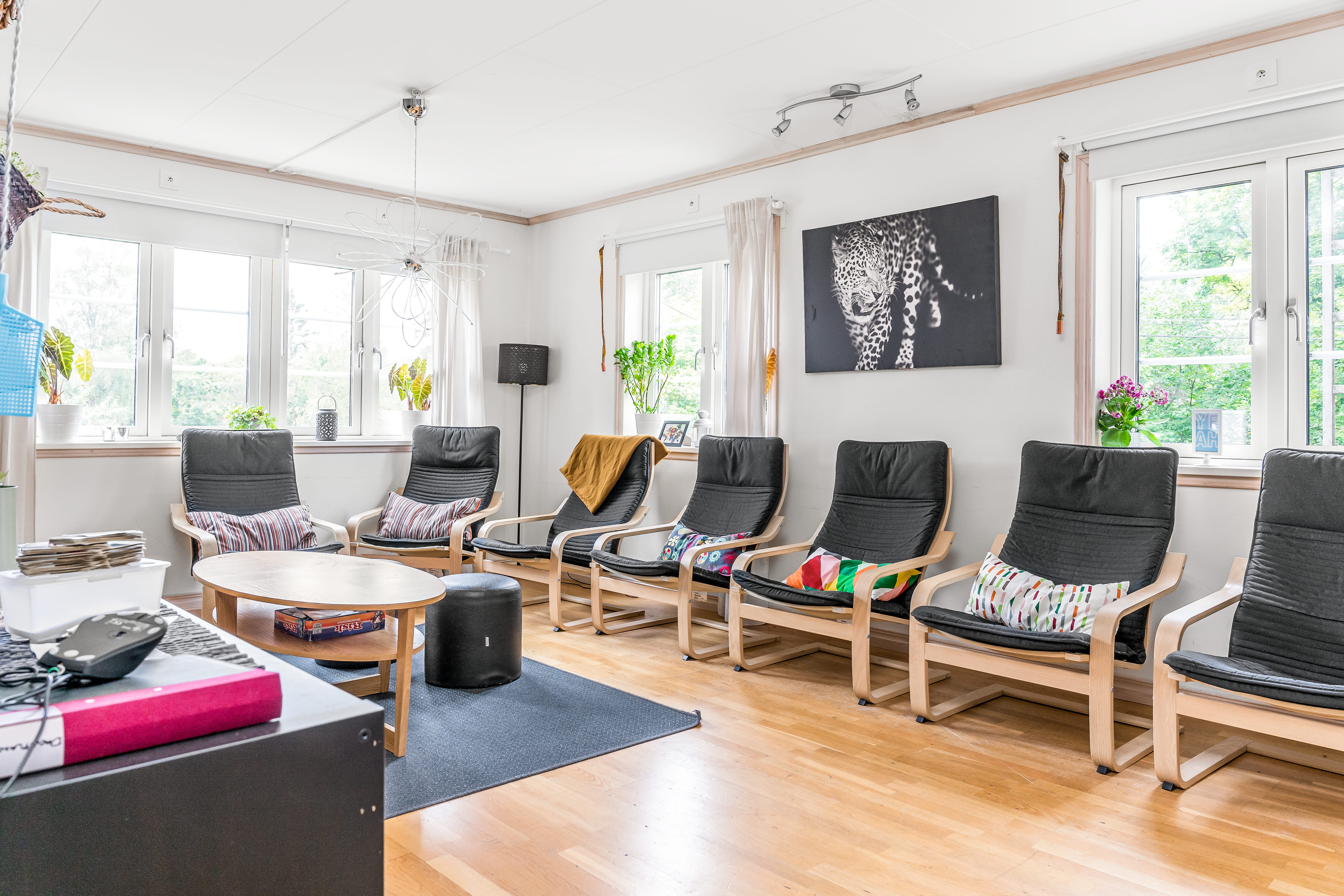 A living room filled with furniture and a large window