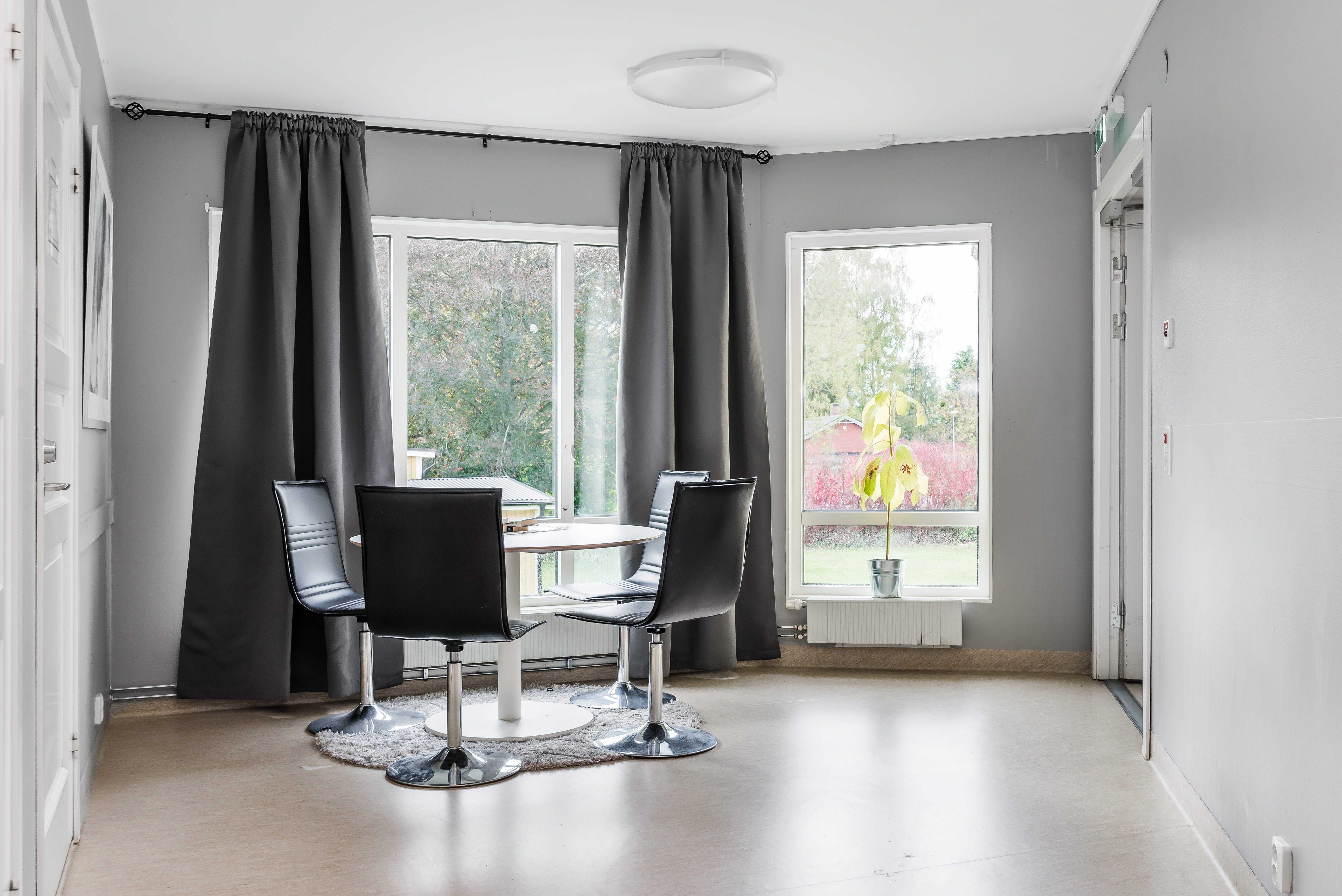 A room filled with furniture and a large window