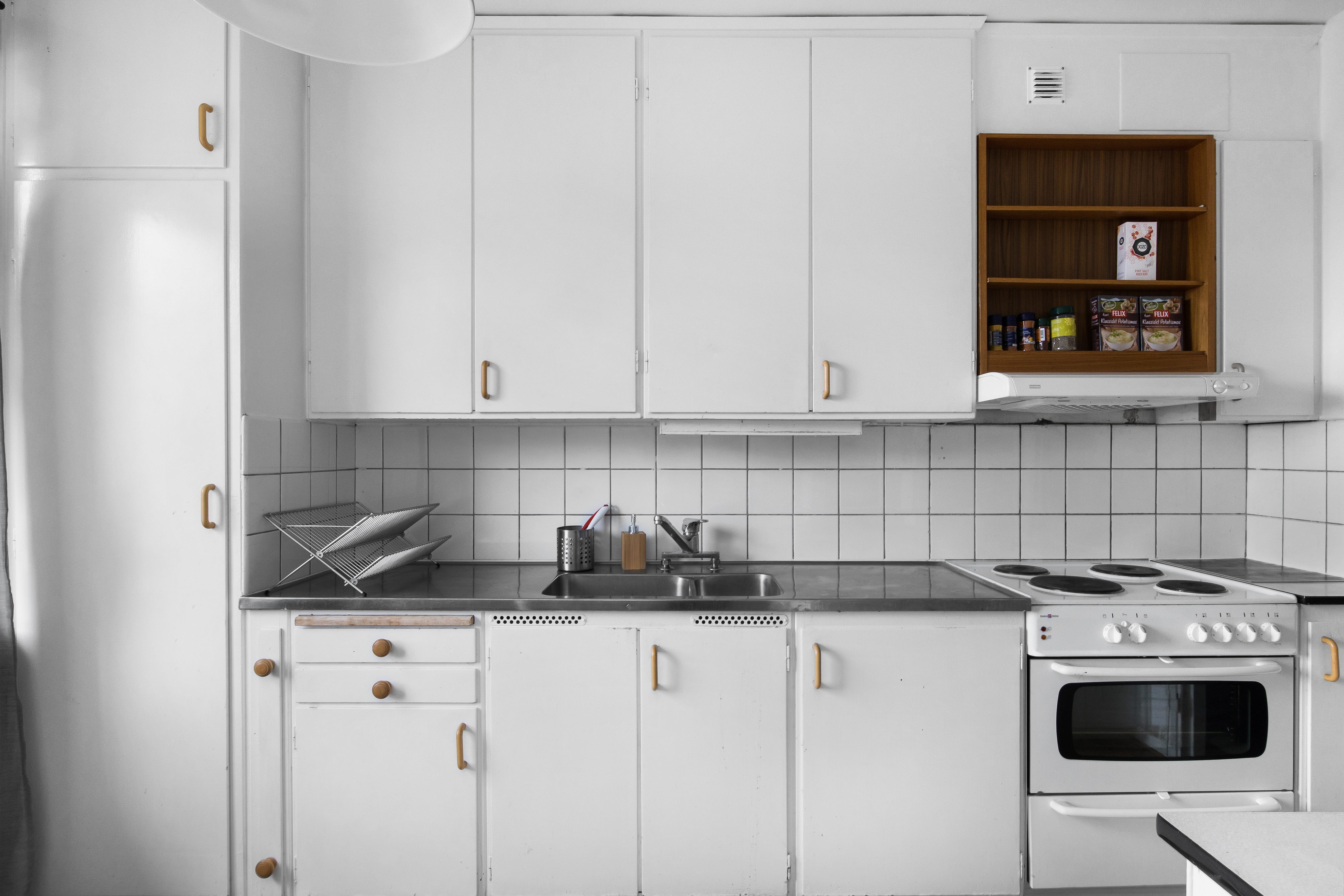 A stove top oven sitting inside of a kitchen