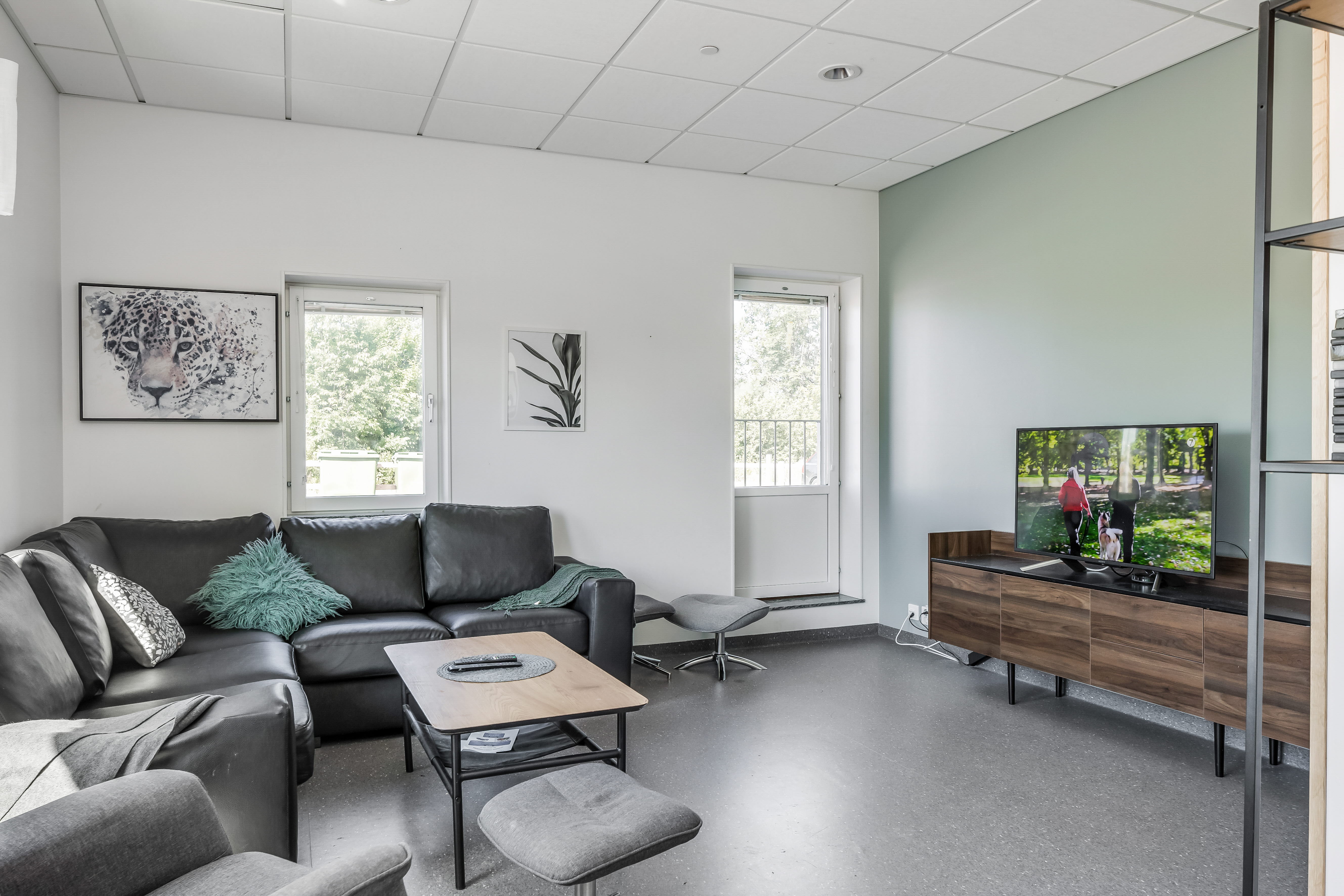 A living room filled with furniture and a flat screen tv