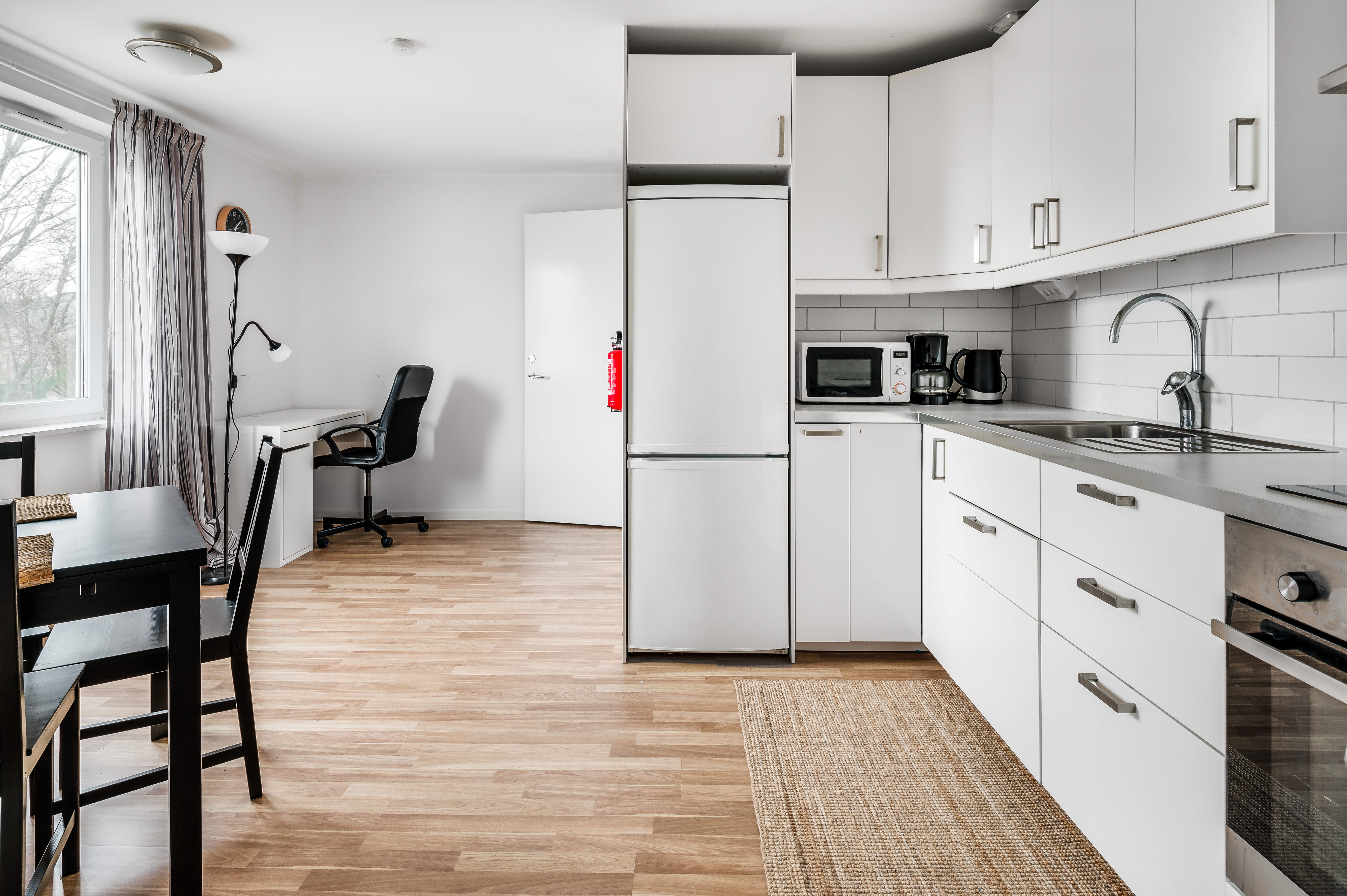 A kitchen with a wood floor